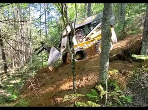 how steep of a hill can a skid steer climb|skid steer loader traction limit.